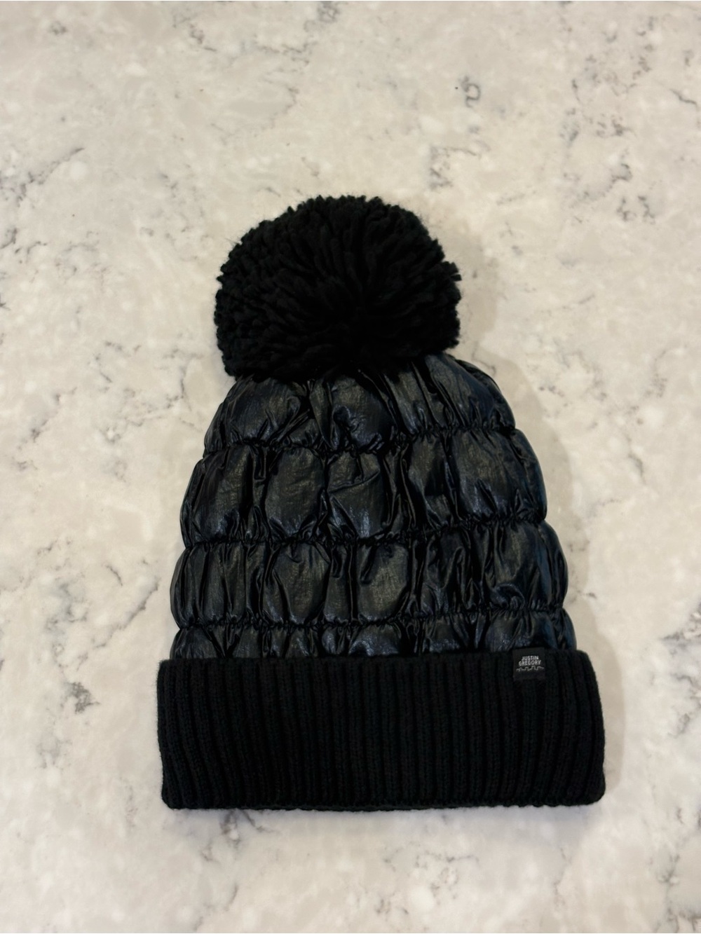Women’s Justin Gregory Quilted Beanie Hat with Pom in Black